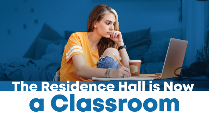 Image of student in front of laptop the residence hall is now a classroom